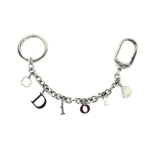 DIOR SPELL OUT BAG CHARM SILVER